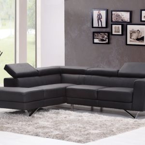 Contemporary living room featuring a sleek black sectional sofa and chic wall art.